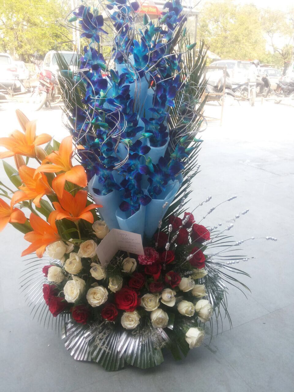 Blue Orchid, Orange Lilly & Roses Arrangement